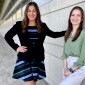 Students Kate Carver and Melany Morales pose in an outdoor location