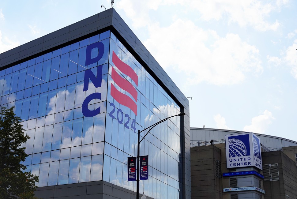 A building with DNC written on it, with the sign of the United Center in the background