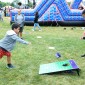 A child plays corn hole 