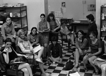 A black-and-white photograph of New York Radical Women organizers sitting in a meeting