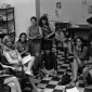 A black-and-white photograph of New York Radical Women organizers sitting in a meeting