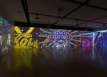 A view of the video installation "The Great Farce" by Federico Solmi shows the work's title 