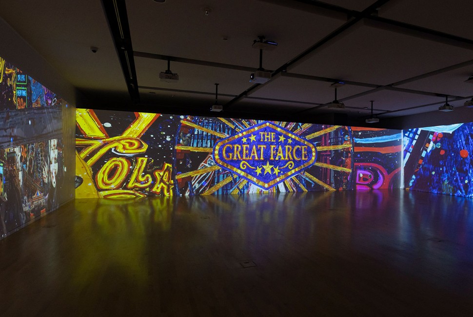 A view of the video installation "The Great Farce" by Federico Solmi shows the work's title 