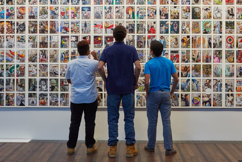 three people look at a collage