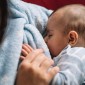 close-up of baby breastfeeding