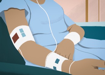 a patient in a gown from the neck down 