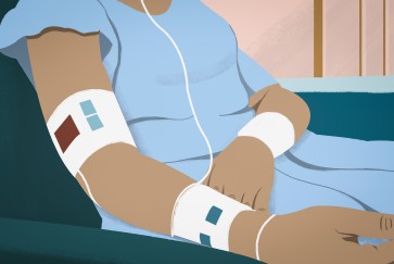 a patient in a gown from the neck down 