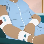 a patient in a gown from the neck down 