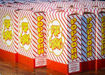 Popcorn boxes lined up on a table