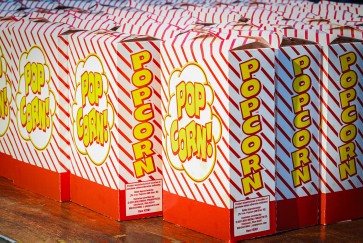 Popcorn boxes lined up on a table