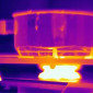 a thermal image of a pot on a lit stove