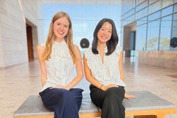 Klara Vinn, left, and Justine Liu, right, pose in the atrium of the Ryan Center for the Arts