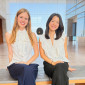 Klara Vinn, left, and Justine Liu, right, pose in the atrium of the Ryan Center for the Arts