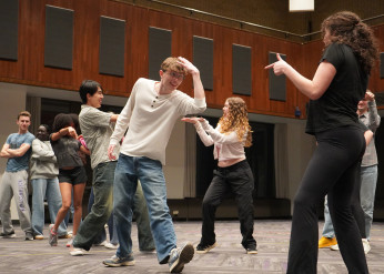 Students dance during a rehearsal for Footloose 