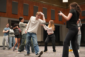 Students dance during a rehearsal for Footloose 