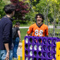 two student smile as they play a lawn game at finals relief