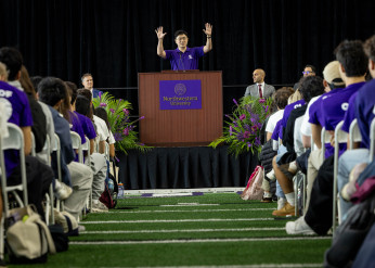 Mung Chiang addresses students from a podium during his first convocation address