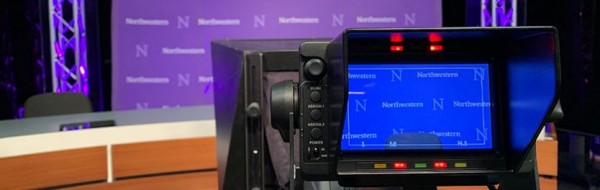 television studio camera pointing at Northwestern backdrop