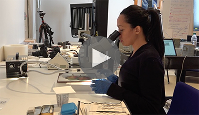 Woman at microscope