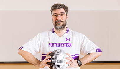 Amaral holding soccer ball