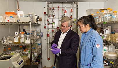 O'Halloran working with student in lab 1
